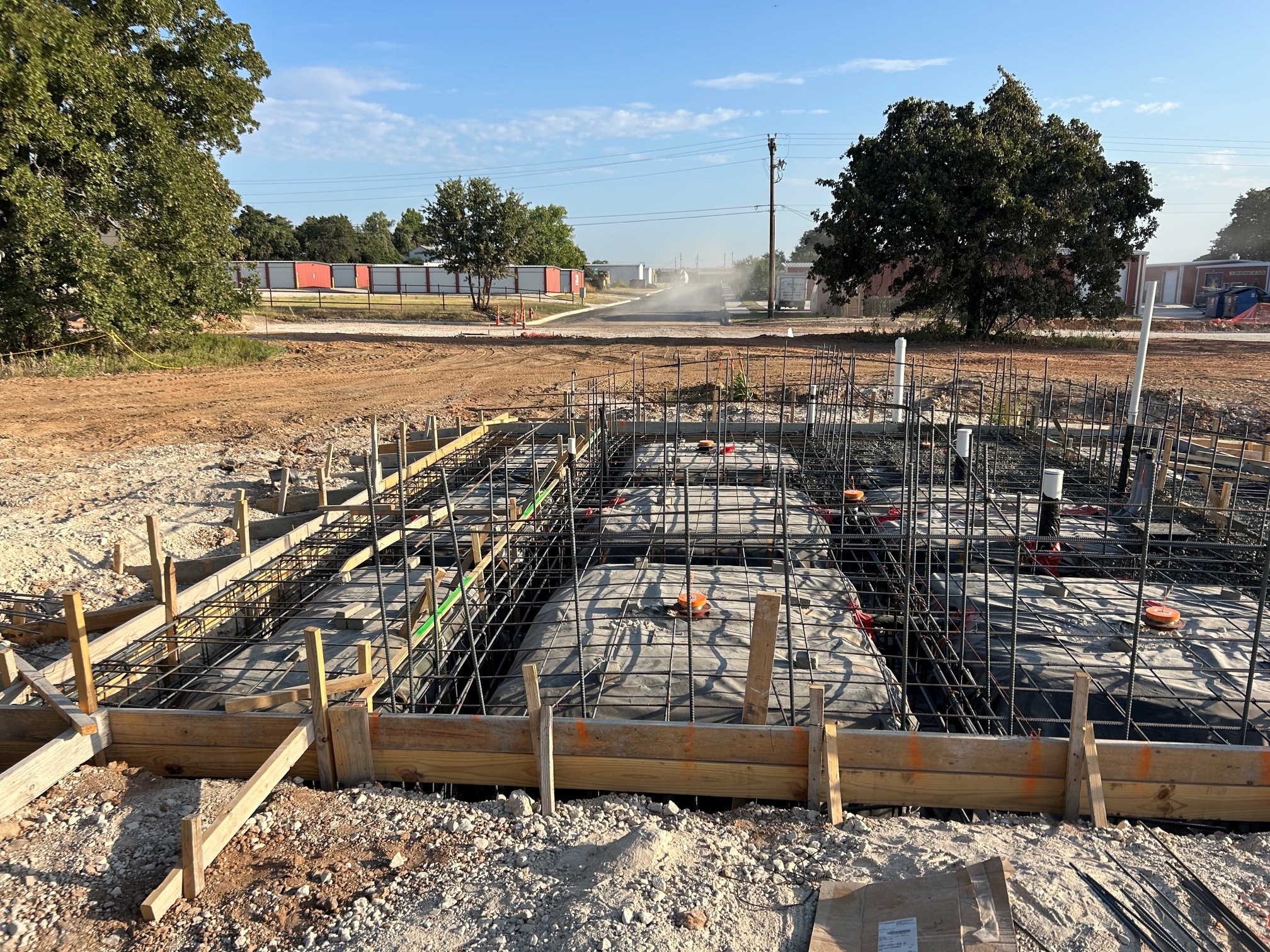Foundation excavation with rebar and forms ready for inspection